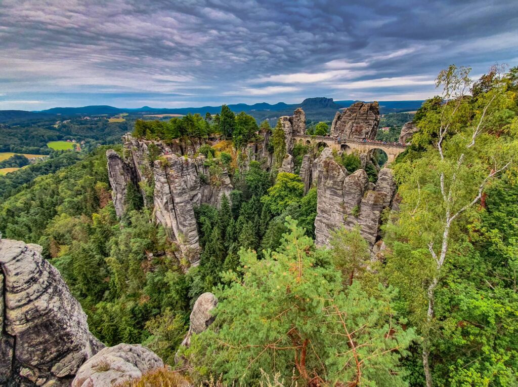 Bastei Bridge view, Saxon Switzerland A stone bridge among towering rock formations and greenery in Saxon Switzerland National Park - Bastei Bridge