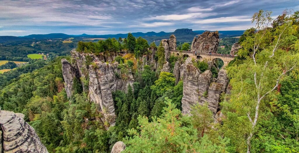 Rock formations among greenery in Saxon Switzerland National Park, Germany