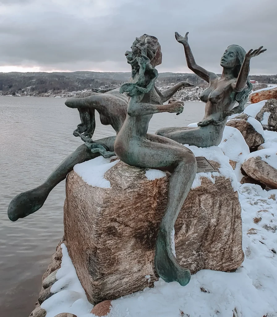 Mermaids in Drøbak Snow-covered mermaids statue in Drøbak, Norway