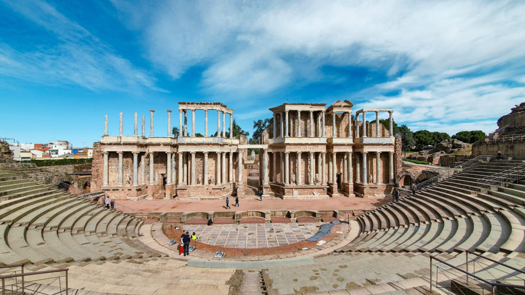 The Roman Theatre of Mérida, a landmark on the Via de la Plata Camino de Santiago, with semicircular seating and ancient Roman columns.