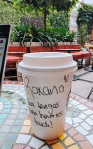 A message on a take away coffee cup at Starbucks saying "have a beautiful afternoon"