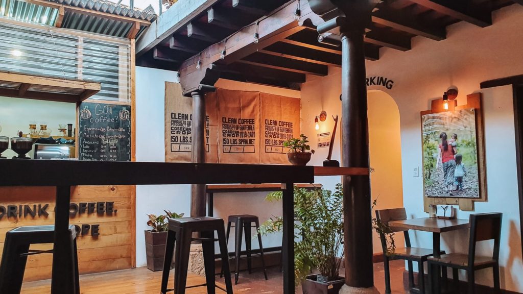 Serve Hope Cafe, a work-friendly cafe in Antigua Guatemala with pictures and coffee burlap sacks adorning the walls