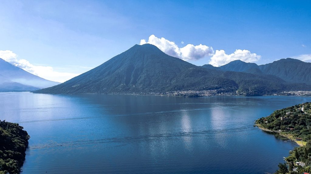 View from above of Lake Atitlán with volcano in the background
