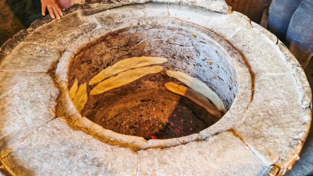 Bread being backed in traditional Georgian oven