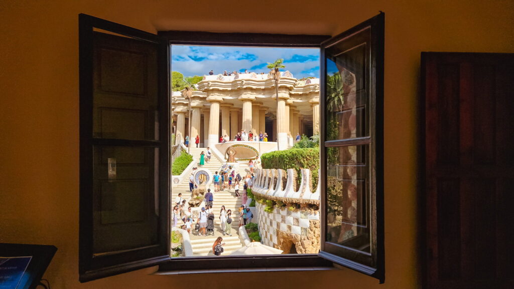 Park Güell, view from Casa del Guarda View of the monumental stairway in Park Güell through an open window