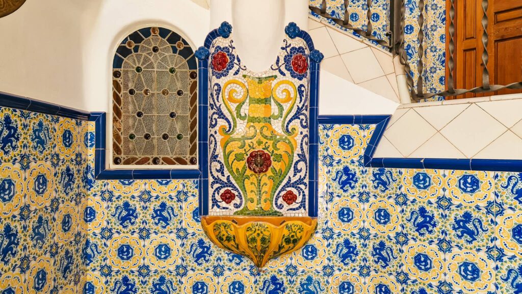 Torre Bellesguard, wall fountain Colorful tiled wall inside Torre Bellesguard