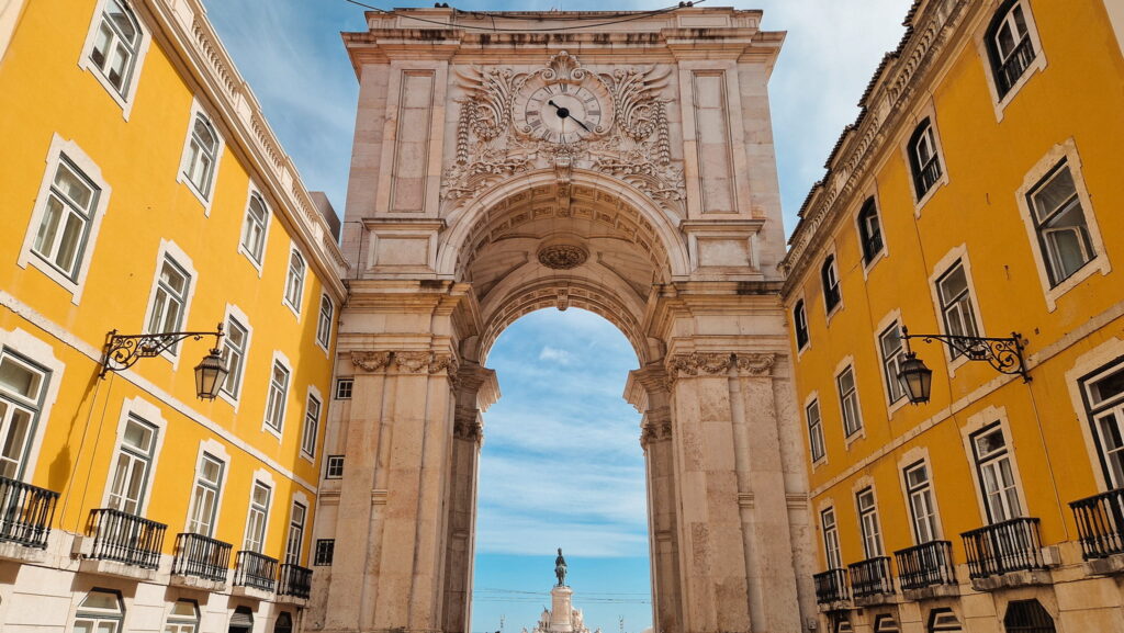 Lisbon Rua Augusta Arco da Rua Augusta, marble arch in between two yellow buildings, Lisbon